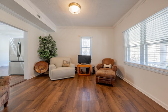 3512 Conner Grove Rd SW, Willis, VA 24380 - sitting room with wood finished floors, ornamental molding, and baseboards