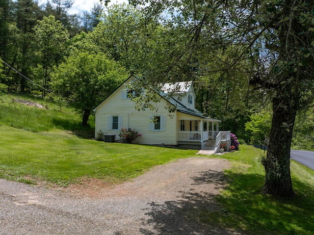 3512 Conner Grove Rd SW, Willis, VA 24380 - view of property exterior with a porch, driveway, central AC unit, and a lawn