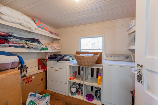 clothes washing area featuring independent washer and dryer, wood finished floors, laundry area, and wooden ceiling
