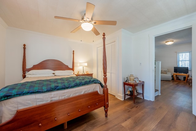 3512 Conner Grove Rd SW, Willis, VA 24380 - bedroom with wood finished floors, a closet, crown molding, and ceiling fan
