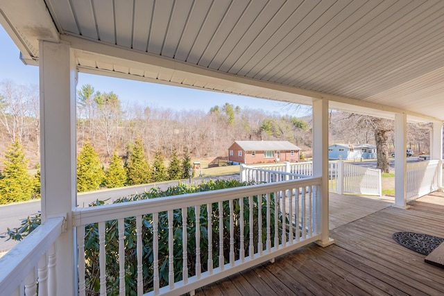 wooden terrace with a porch
