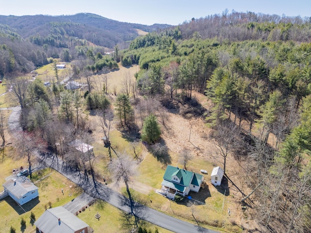 bird's eye view featuring a mountain view and a view of trees
