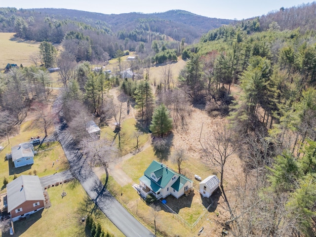 bird's eye view with a wooded view and a mountain view