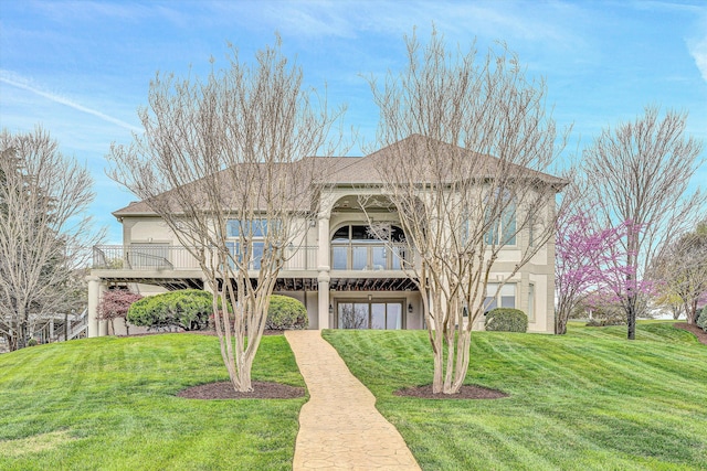 view of front of property with a front lawn and stucco siding