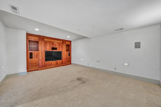 unfurnished living room with light colored carpet, baseboards, visible vents, and recessed lighting