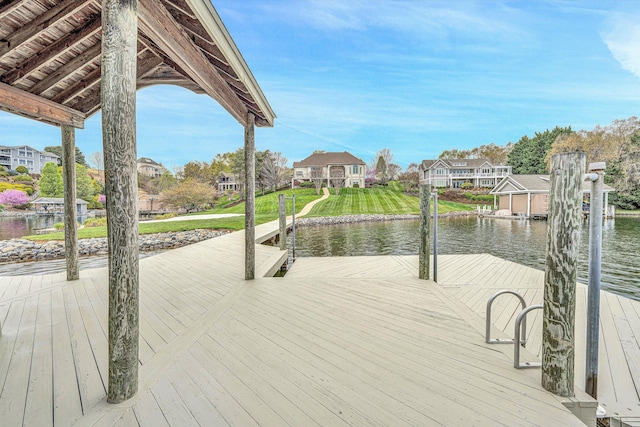 dock area featuring a yard and a water view