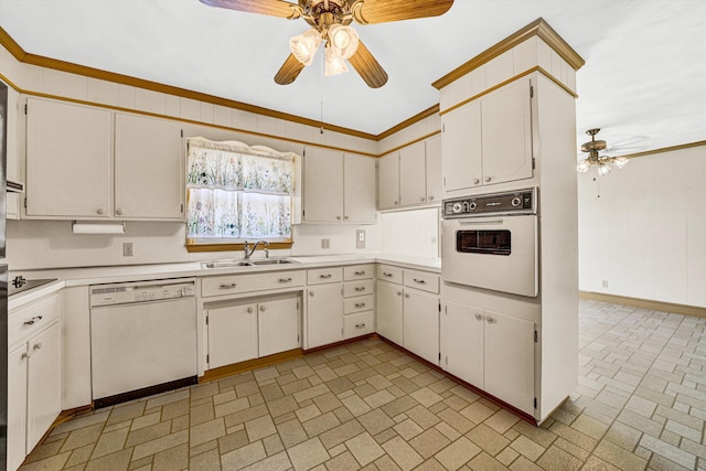 kitchen featuring a sink, brick patterned floor, a ceiling fan, and white appliances