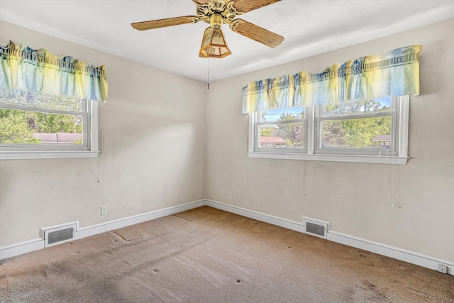 unfurnished room featuring carpet flooring, baseboards, and visible vents