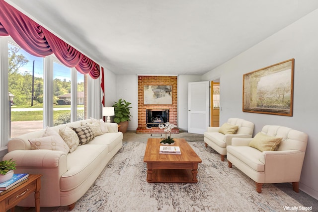 living room featuring baseboards and a fireplace
