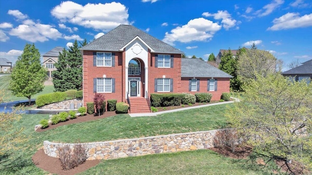 20 Ohara Dr, Daleville, VA 24083 - colonial home with roof with shingles, a front yard, and brick siding