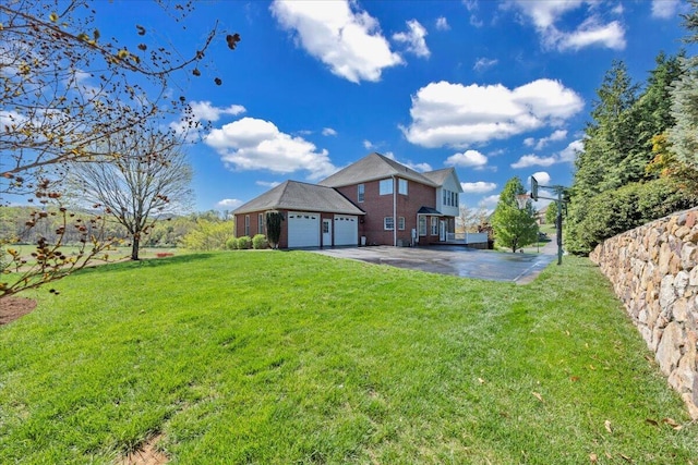 20 Ohara Dr, Daleville, VA 24083 - back of property featuring a yard, brick siding, driveway, and an attached garage