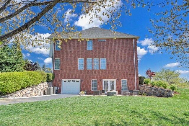 20 Ohara Dr, Daleville, VA 24083 - view of side of home with a garage, brick siding, driveway, and a lawn