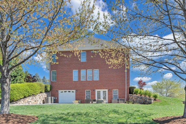 20 Ohara Dr, Daleville, VA 24083 - exterior space with an attached garage, central air condition unit, a front lawn, and brick siding