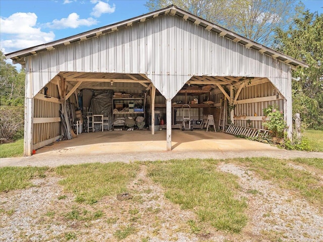 surrounding community featuring an outbuilding, an outdoor structure, and a carport