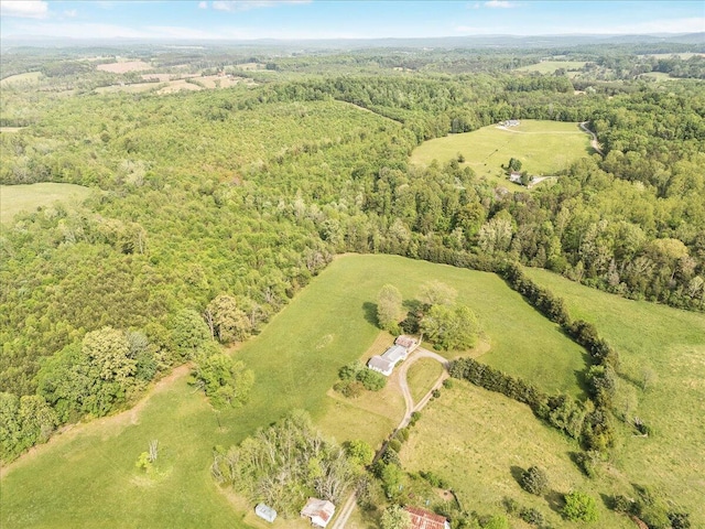 birds eye view of property with a wooded view