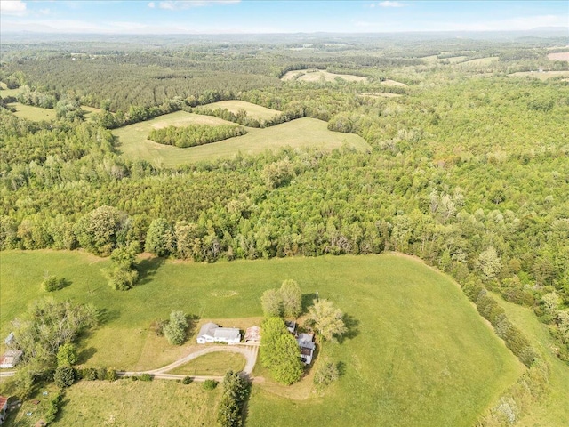 drone / aerial view with a wooded view
