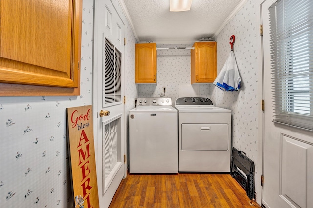 10131 Sontag Rd, Martinsville, VA 24112 - laundry area with wallpapered walls, washing machine and dryer, cabinet space, and a textured ceiling