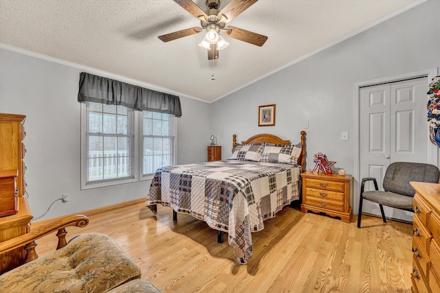 10131 Sontag Rd, Martinsville, VA 24112 - bedroom featuring a textured ceiling, light wood-style flooring, crown molding, a ceiling fan, and lofted ceiling