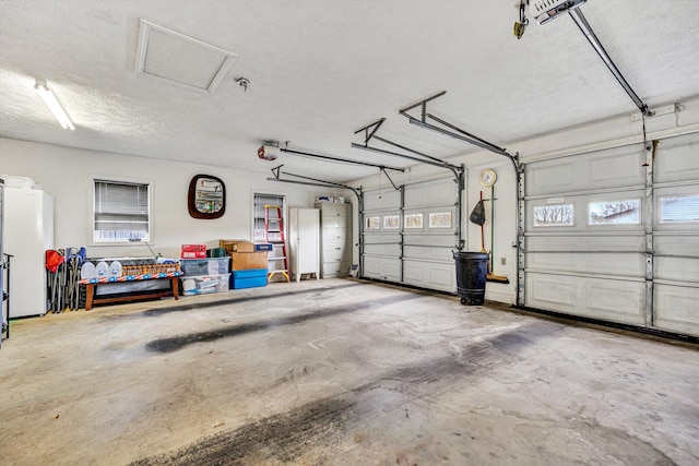 10131 Sontag Rd, Martinsville, VA 24112 - garage with freestanding refrigerator and a garage door opener