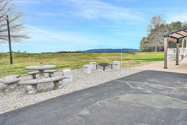 10131 Sontag Rd, Martinsville, VA 24112 - view of patio / terrace featuring an outdoor fire pit, a gazebo, and a mountain view