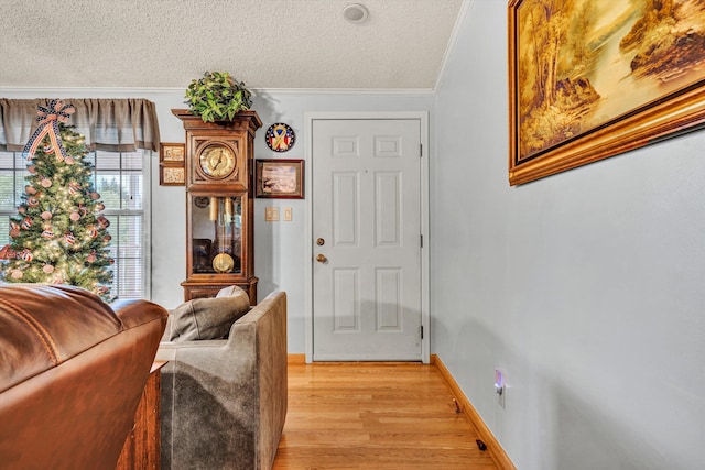 10131 Sontag Rd, Martinsville, VA 24112 - entryway featuring light wood-style flooring, ornamental molding, baseboards, and a textured ceiling