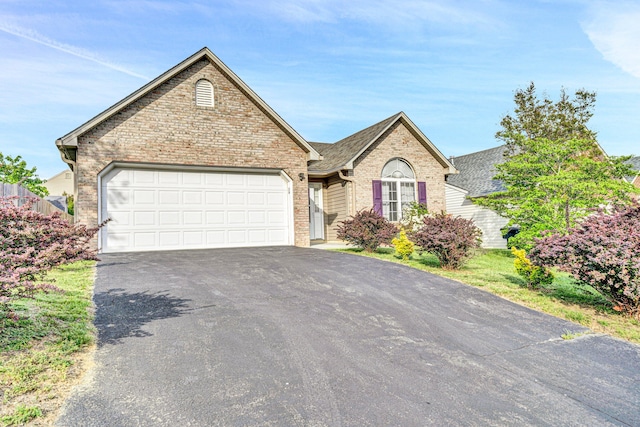 6815 Cee St, Roanoke, VA 24019 - single story home with brick siding, a shingled roof, an attached garage, and aphalt driveway