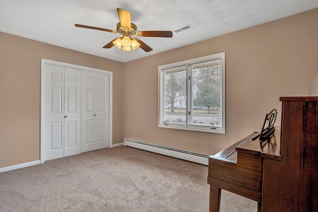 1714 Orchard Dr, Salem, VA 24153 - carpeted bedroom with a closet, a baseboard heating unit, baseboards, a ceiling fan, and visible vents