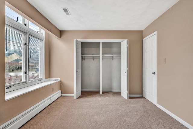 1714 Orchard Dr, Salem, VA 24153 - unfurnished bedroom featuring visible vents, a closet, baseboards, a baseboard radiator, and light carpet