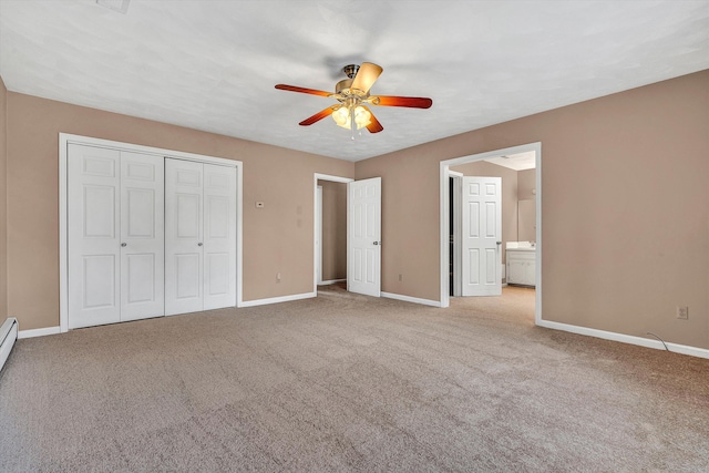 1714 Orchard Dr, Salem, VA 24153 - unfurnished bedroom featuring a closet, baseboards, ensuite bathroom, a ceiling fan, and carpet