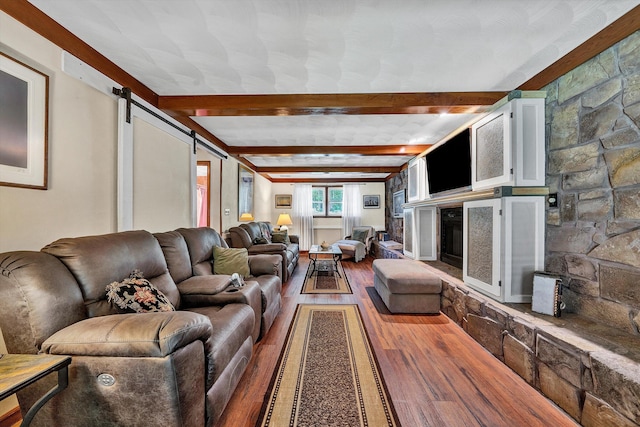 113 Lake Park Dr, Union Hall, VA 24176 - living area featuring a barn door, wood finished floors, and beam ceiling