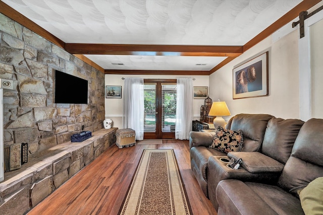 113 Lake Park Dr, Union Hall, VA 24176 - living area featuring a barn door, wood finished floors, and beam ceiling