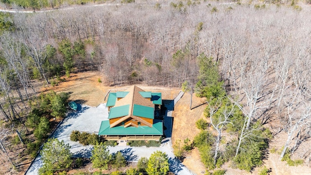 bird's eye view featuring a wooded view