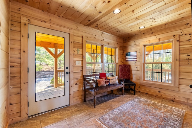 entryway featuring wood ceiling, wood walls, and recessed lighting