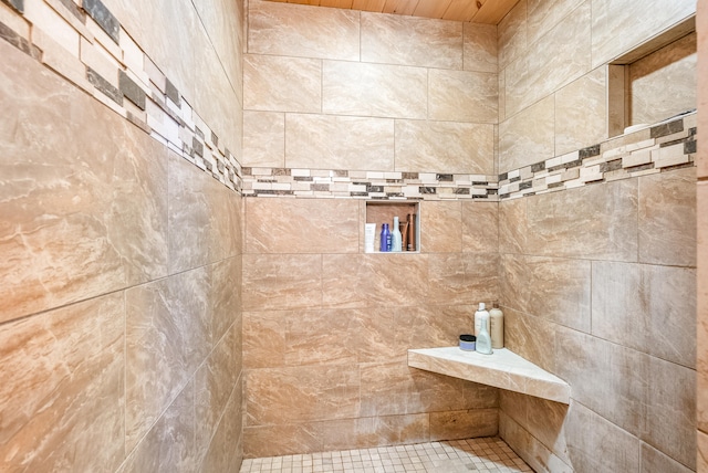 bathroom with tiled shower