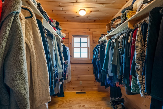 walk in closet with visible vents and wood finished floors
