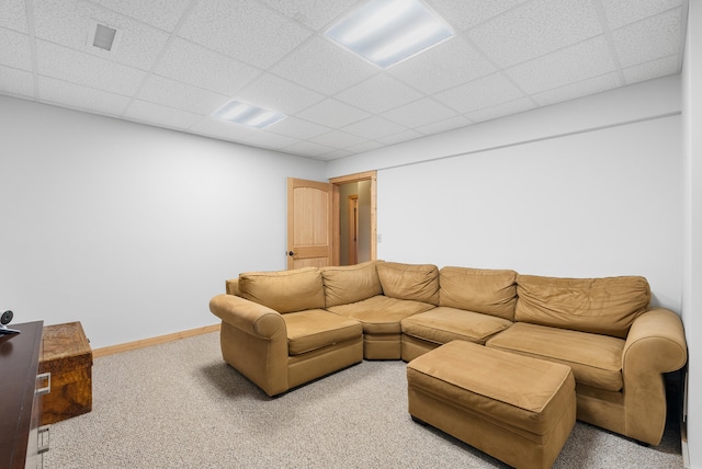 living room with visible vents, light carpet, baseboards, and a paneled ceiling