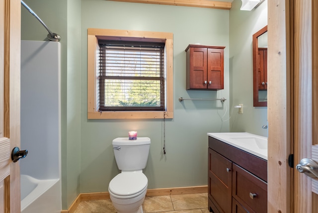 bathroom with baseboards, toilet, tile patterned floors, vanity, and shower / tub combination