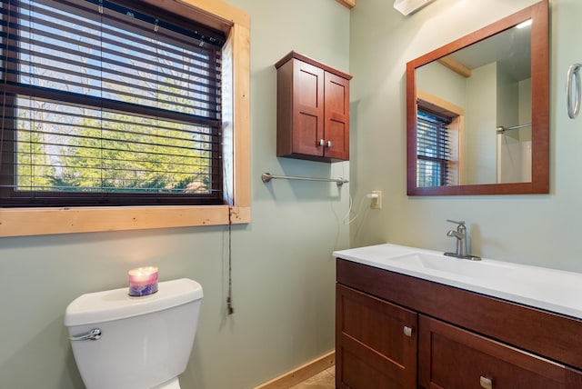 bathroom with toilet and vanity
