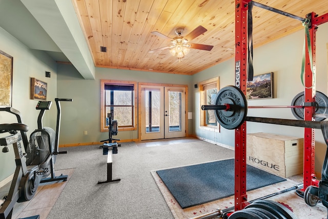 workout room featuring french doors, wooden ceiling, baseboards, carpet floors, and a ceiling fan