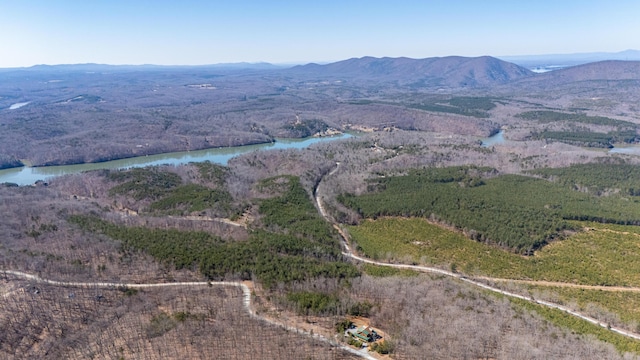 drone / aerial view with a water and mountain view