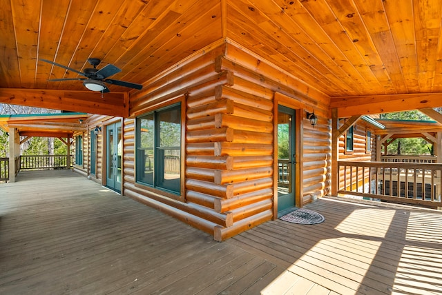 wooden deck featuring ceiling fan