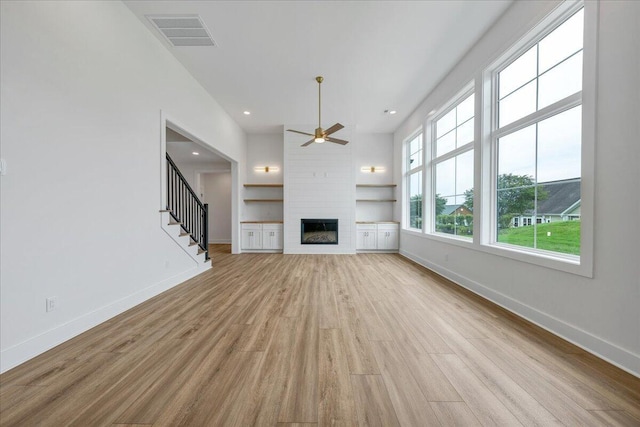 1050 Westerham Ct, Huddleston, VA 24104 - unfurnished living room with baseboards, light wood-style flooring, a ceiling fan, a fireplace, and recessed lighting