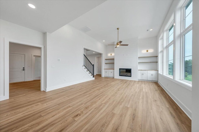 1050 Westerham Ct, Huddleston, VA 24104 - unfurnished living room featuring a ceiling fan, a large fireplace, light wood-style flooring, baseboards, and recessed lighting
