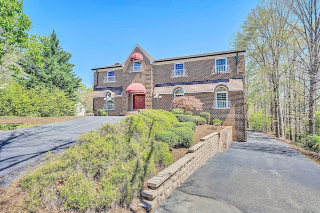 1710 Dawn Ln SW, Roanoke, VA 24018 - tudor-style house with driveway and brick siding