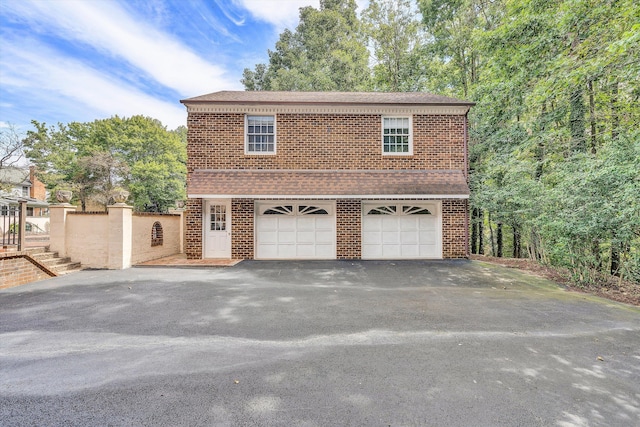 1710 Dawn Ln SW, Roanoke, VA 24018 - garage with electric panel, baseboards, and a garage door opener