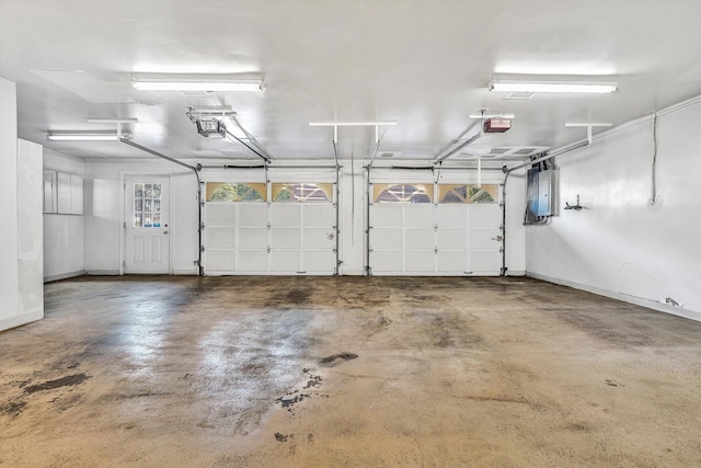 1710 Dawn Ln SW, Roanoke, VA 24018 - garage featuring baseboards, a garage door opener, and electric panel