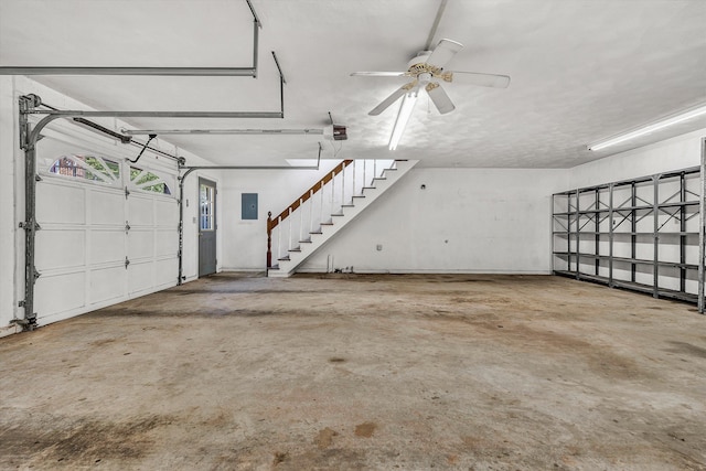 1710 Dawn Ln SW, Roanoke, VA 24018 - garage with a garage door opener, ceiling fan, and electric panel