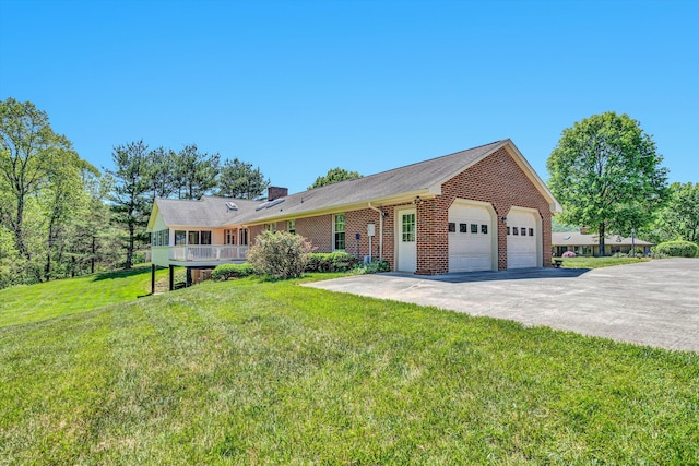 ranch-style house featuring brick siding, a front yard, and a chimney
