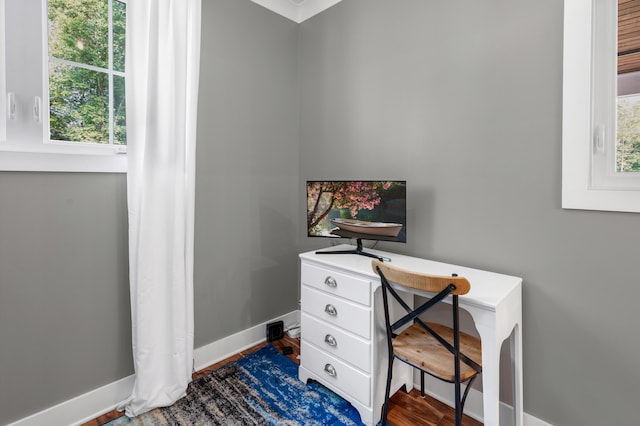 office area featuring dark wood-type flooring and baseboards