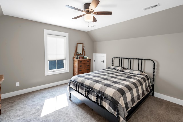 bedroom with visible vents, baseboards, ceiling fan, carpet flooring, and lofted ceiling